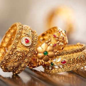 Fancy designer antique golden bracelets for woman fashion studio shot.